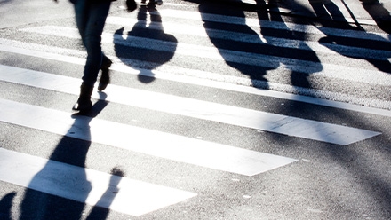 pedestrians walking in crosswalk