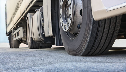 A close up of a semi trucks wheels